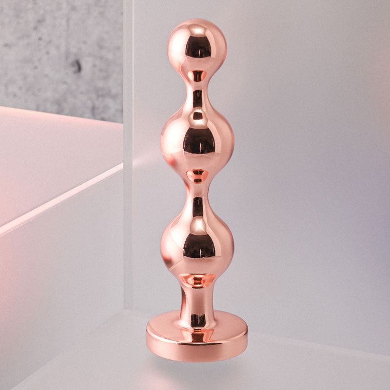 Gender X Gold Digger - Small Rose Gold Butt Plug with Black Gem Base